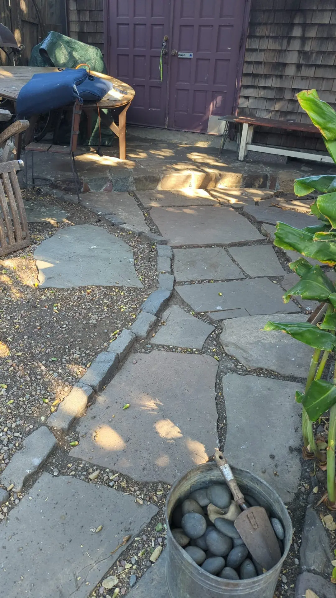 Nicely maintained stone walkway, plants next to the walkway are well maintained